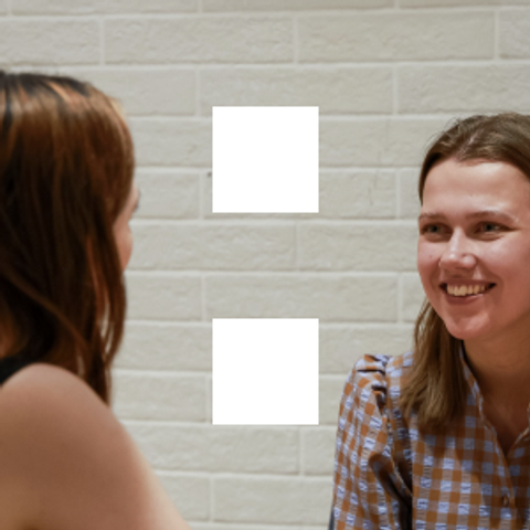 Kat Mellor speaking with one of her mentees