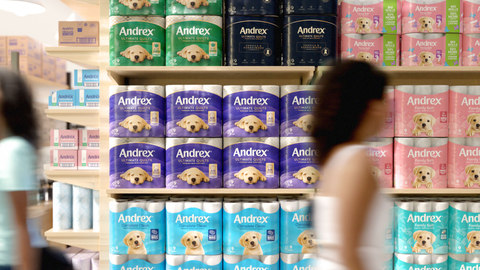 Shop shelves stocked high with all of the differently coloured, newly designed Andrex packs