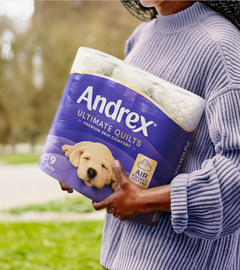 A person carrying home their newly designed Andrex pack from the shop