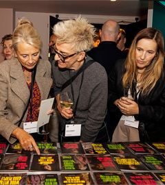 Members of the design industry at Design Podge, browsing the designs created for the event