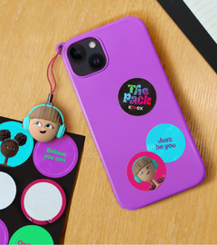 A keychain and a phone case with Kotex: The Pack branded stickers on the back of it