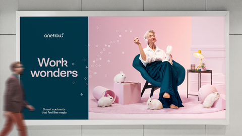 A subway billboard showing a Oneflow advertisement which is a woman sitting in a chair surrounded by rabbits